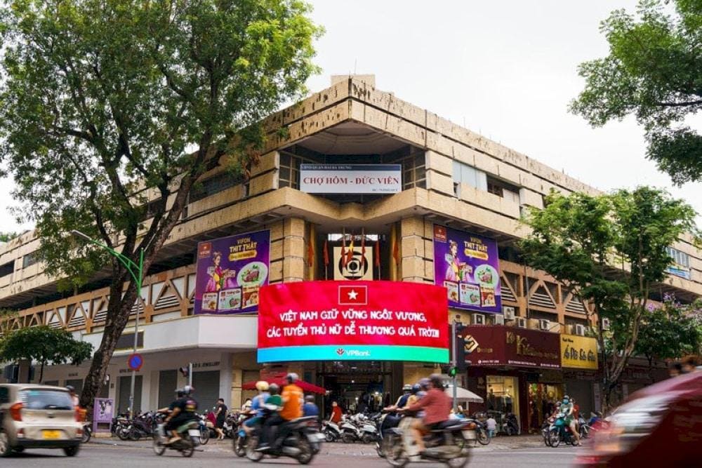 Shoppers browsing through Hanoi's bustling markets, discovering local clothing, handicrafts, and fresh produce